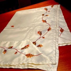 Beautiful polyester tablecloth with leaf and acorn embroidery on it Perfect